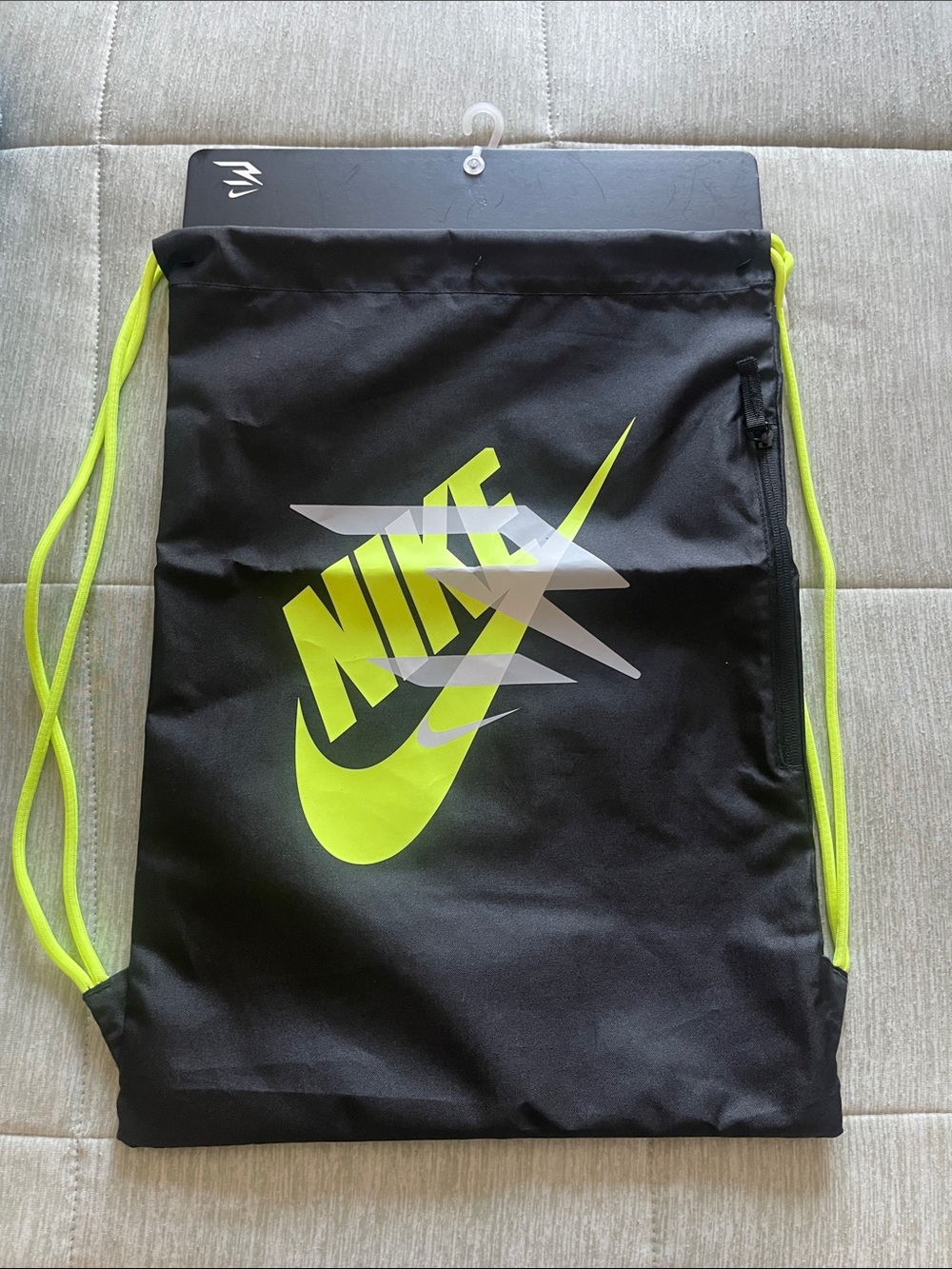 Nike Black Drawstring Backpack with Neon Yellow Logo